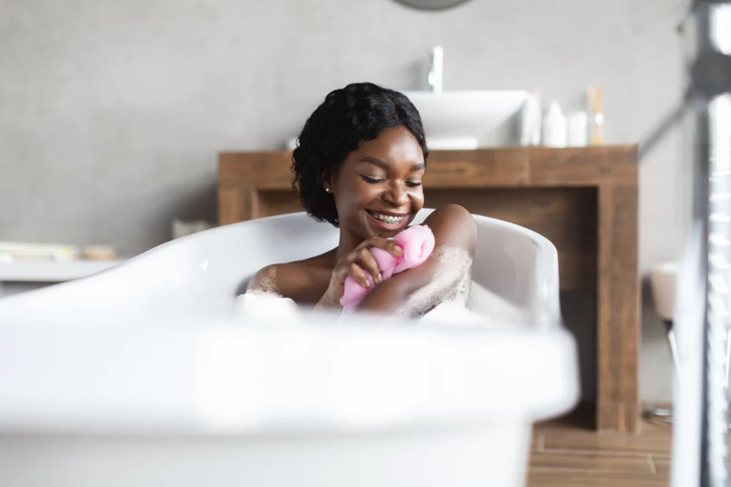 happy young black lady taking foamy bath exfoliat 2022 12 16 06 40 34 utc.jpg