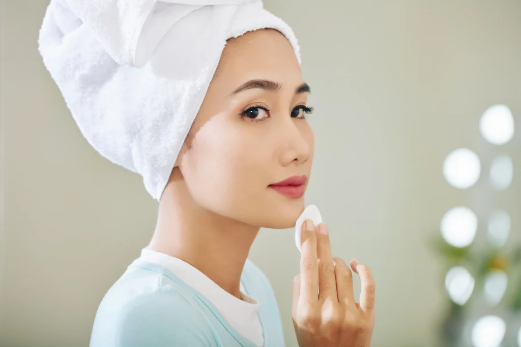 Preventive Dermatology: 4 Easy Steps for Healthy Skin woman cleansing her face after a shower 2026 09 23 12 02 06 utc